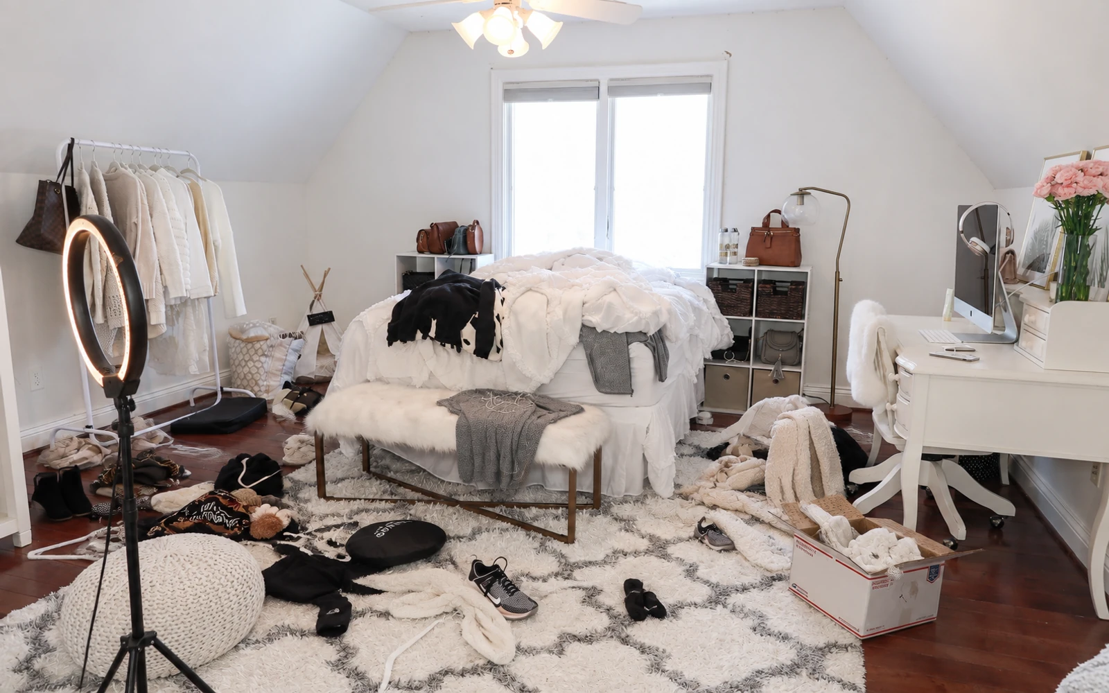 Bedroom with a sloped ceiling, bed and clothes rail — before